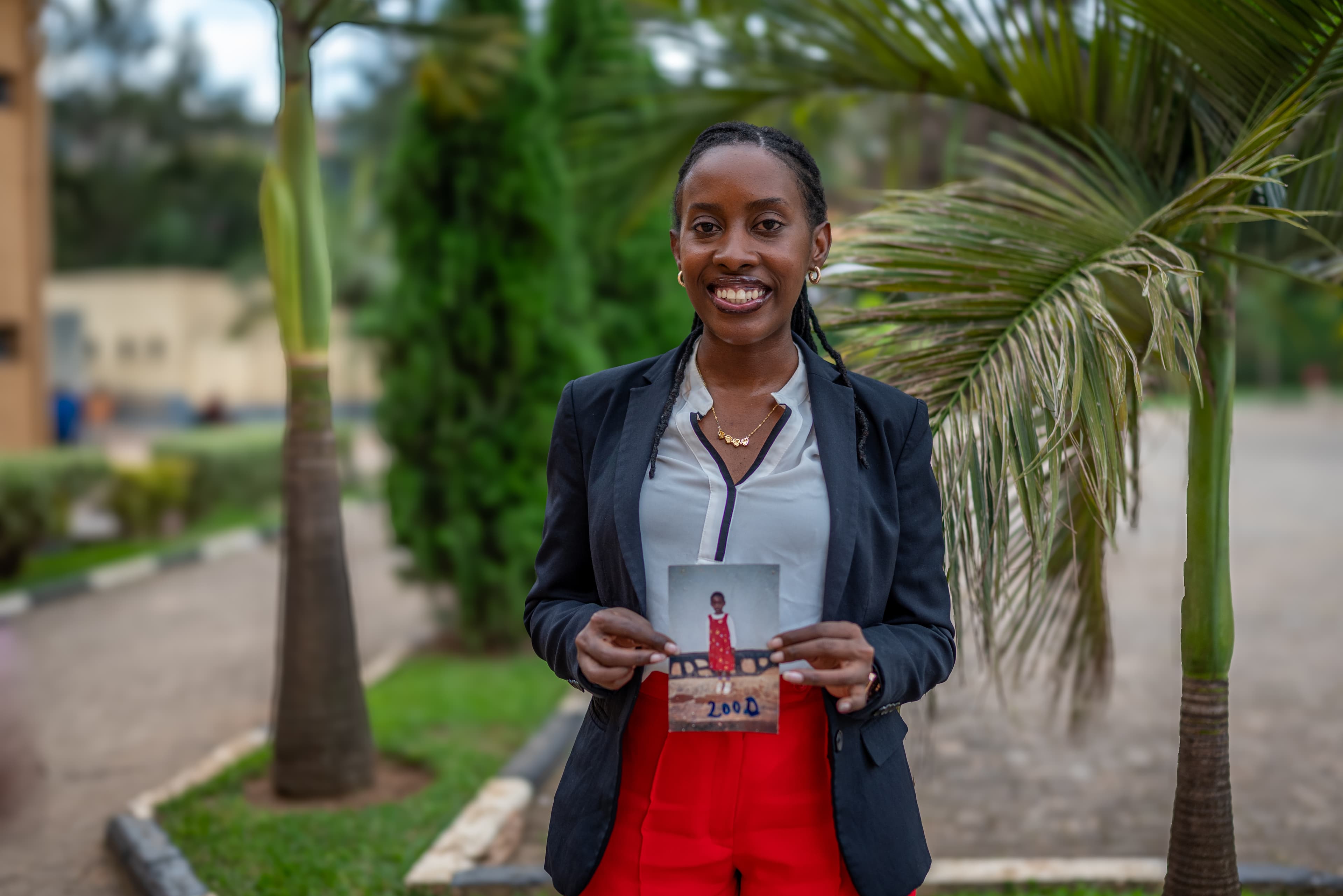 Amina with photo of her younger self