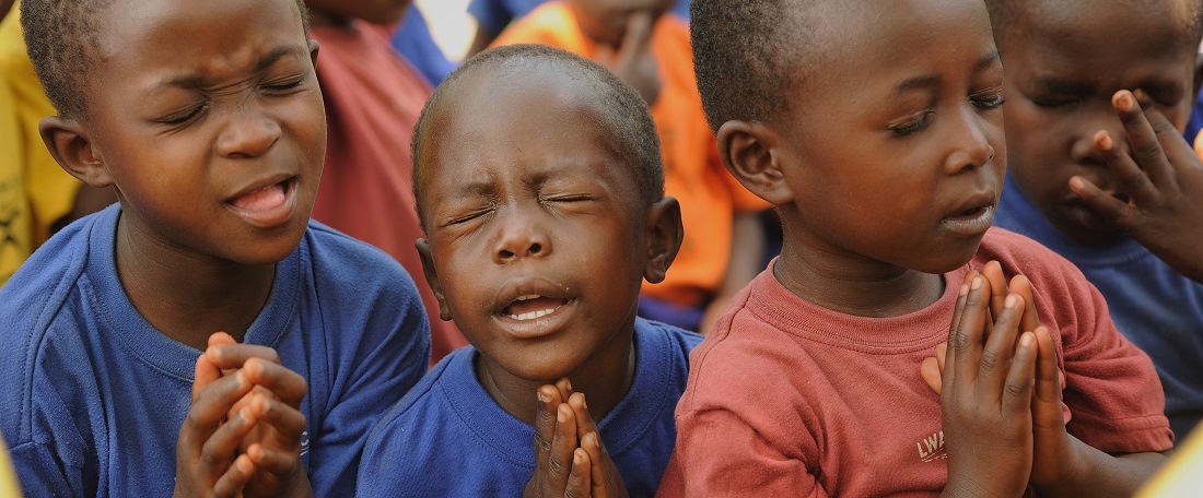 Ugandan sponsored children praying