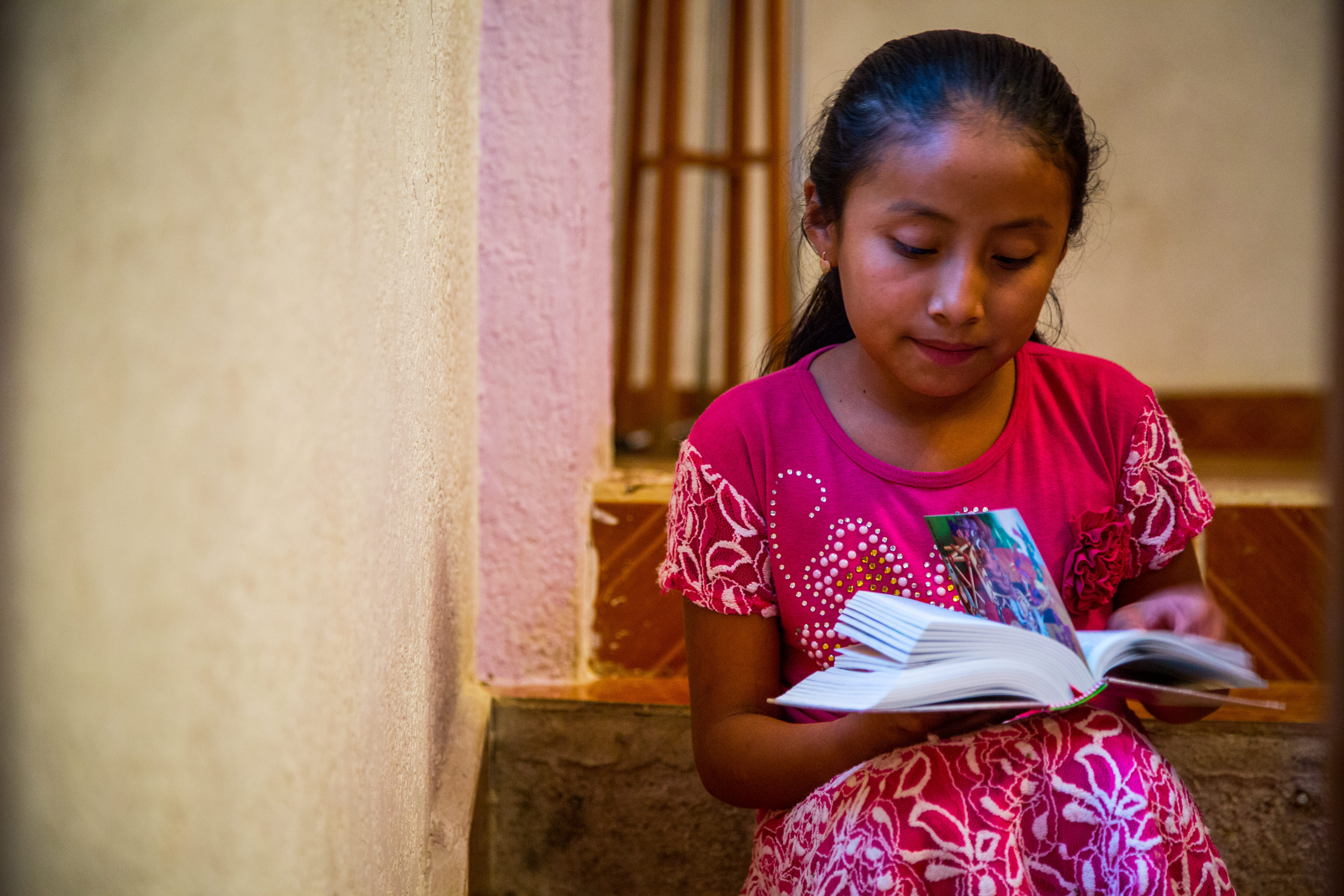 Young girl reading her Bible
