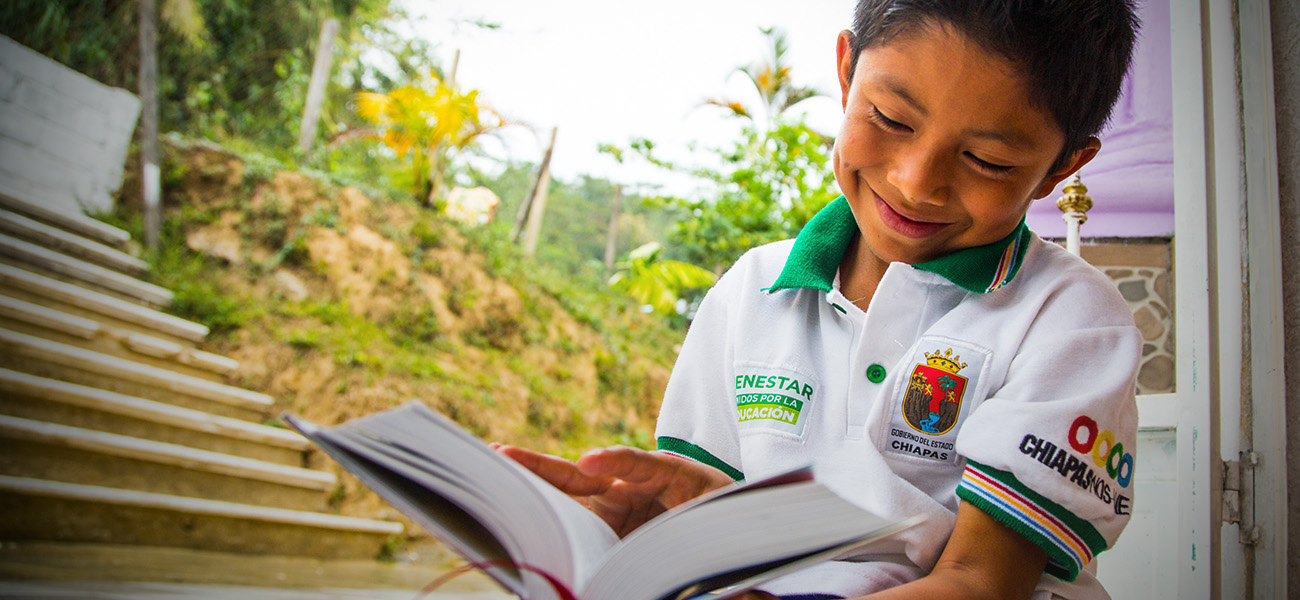 Mexican boy reading Bible