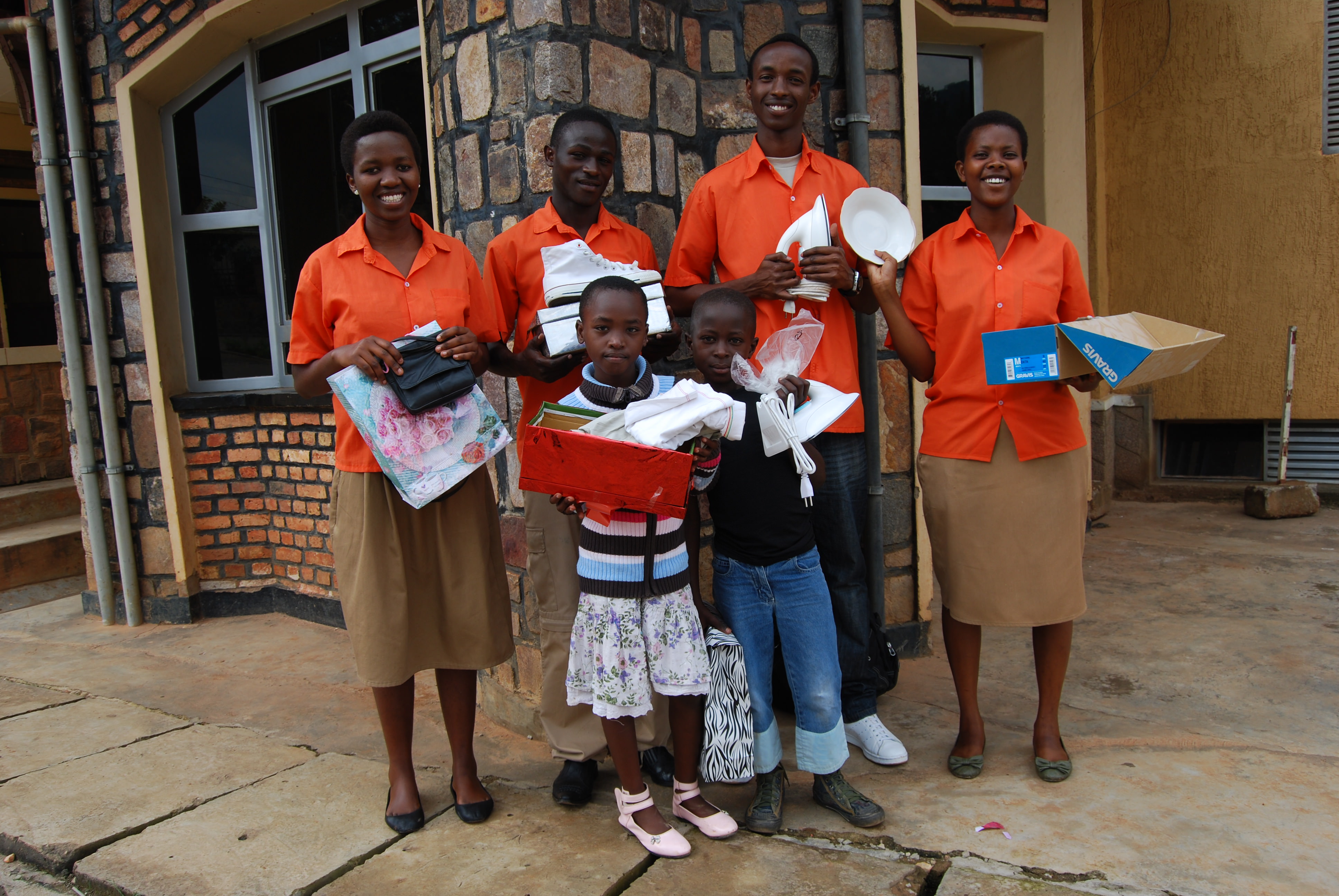 Teenagers in Rwanda with a variety of Christmas presents