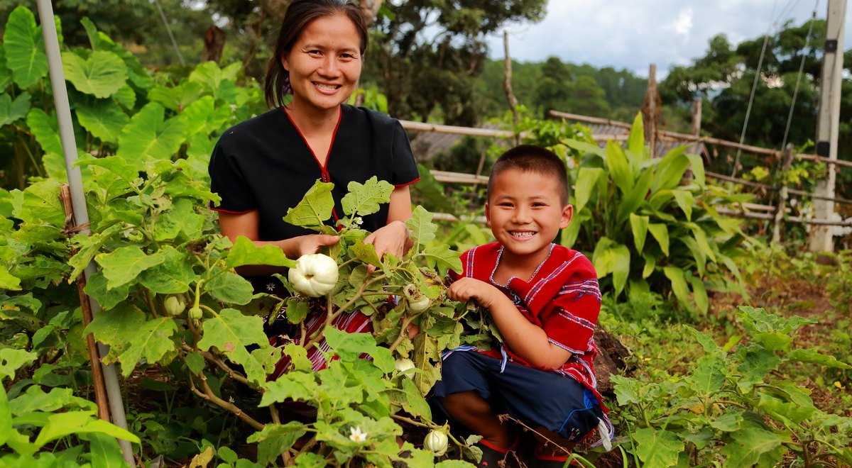 Borisut and his mother in their garden