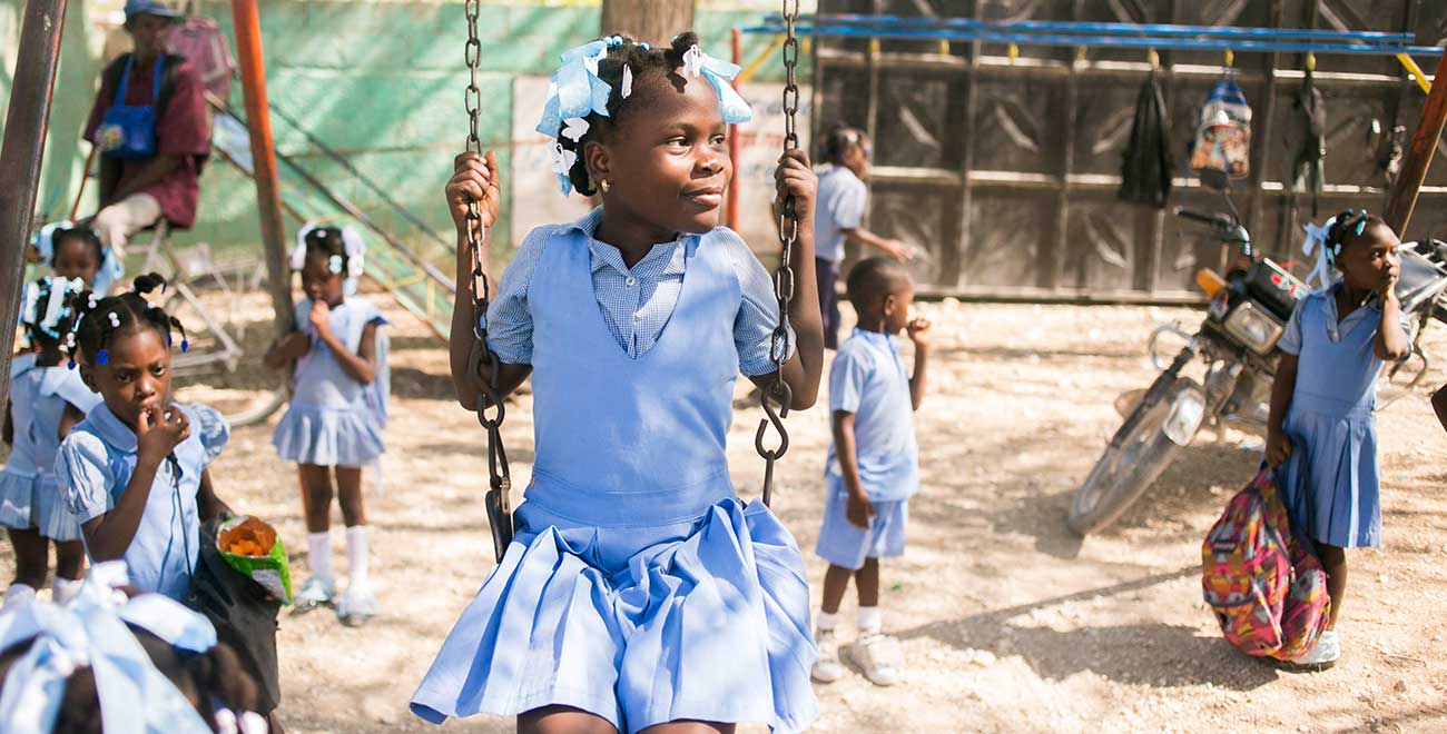 Haitian girl on swing