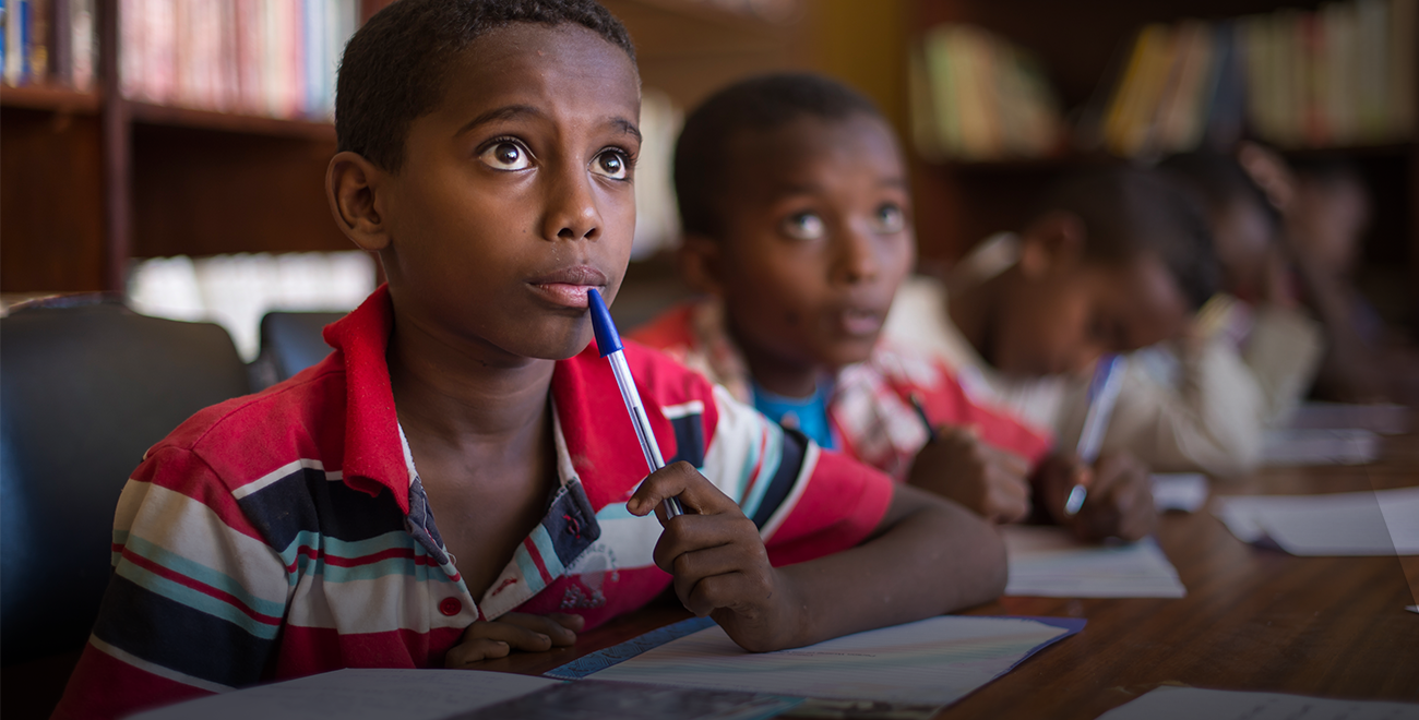 Young boys sitting at desks