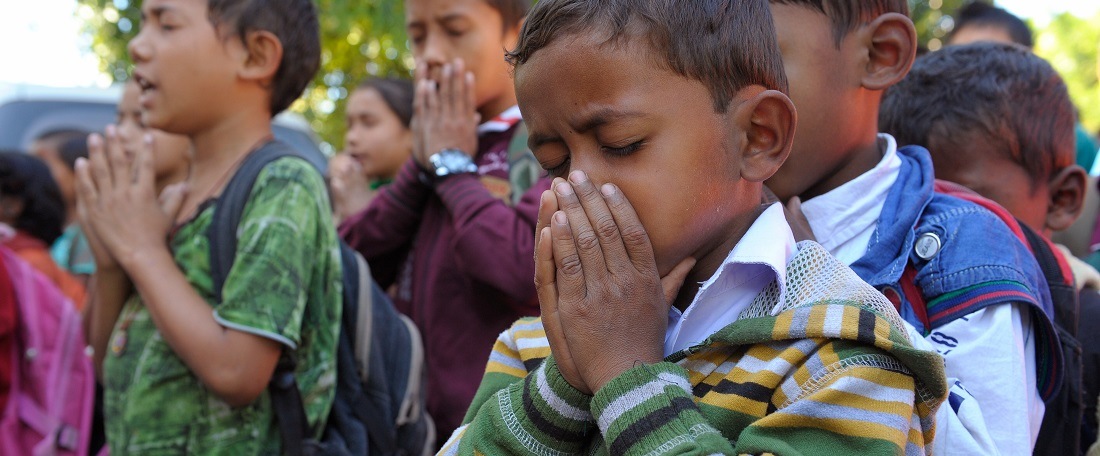 Children praying in East India