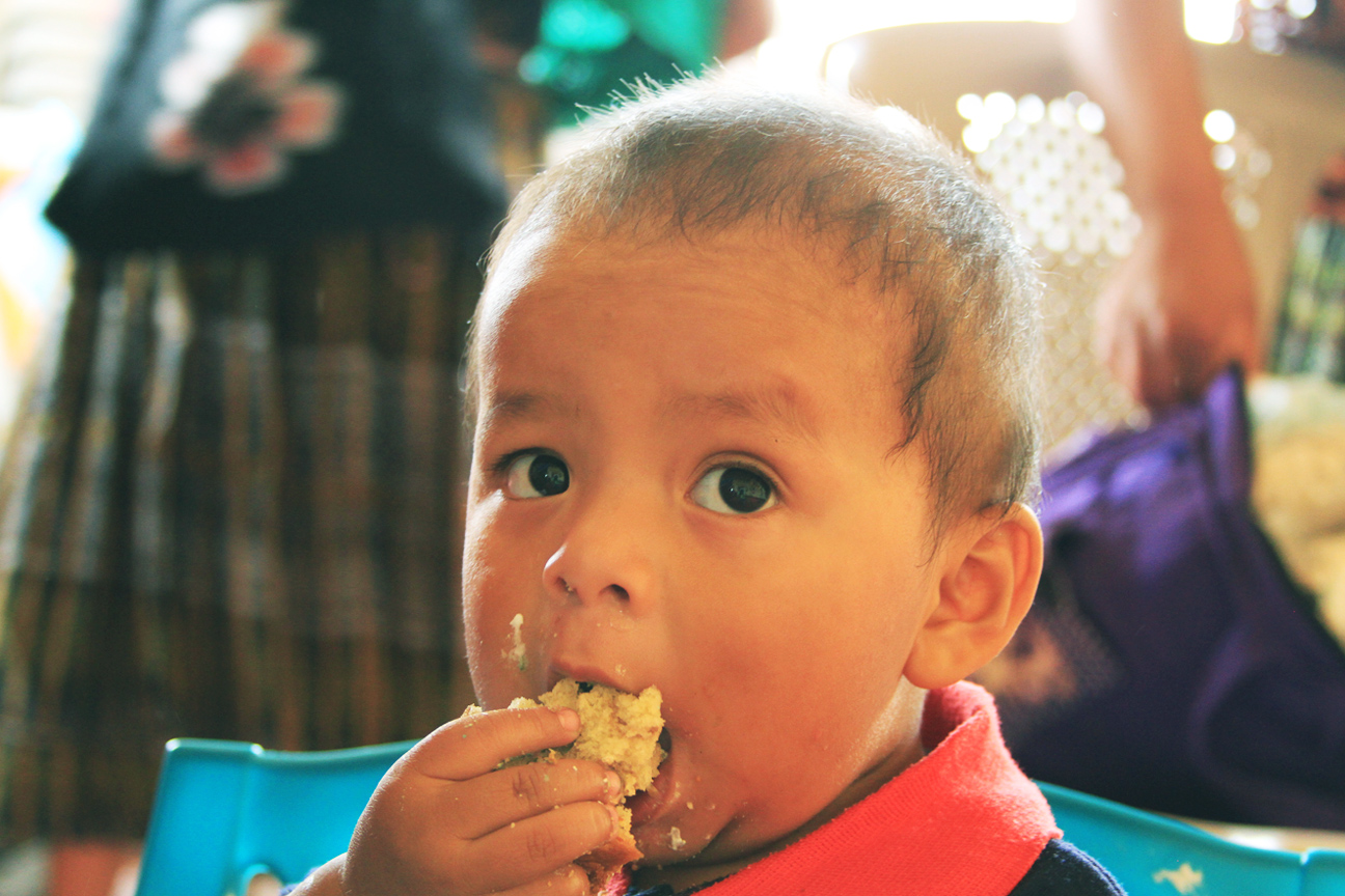 Guatemalan baby eating dinner