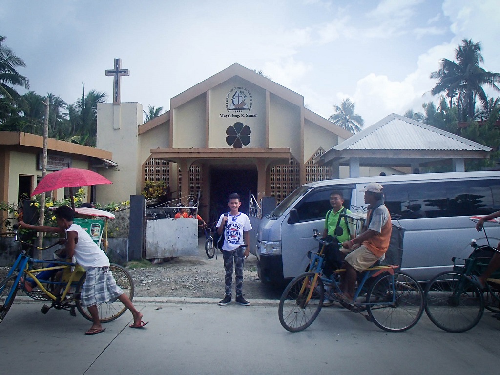 Sponsored child Joshua outside Philippines church