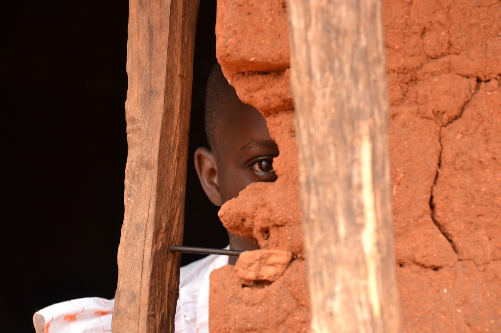 Koki looking from behind a wall