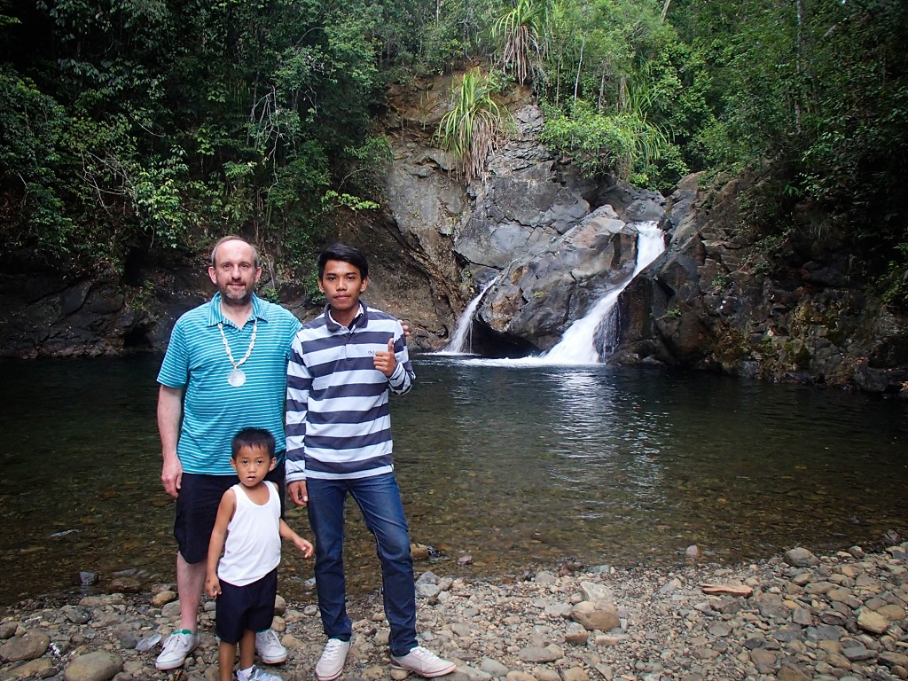 Tim with his sponsored child in the Philippines