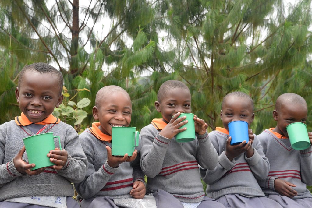 Children drinking in Uganda.