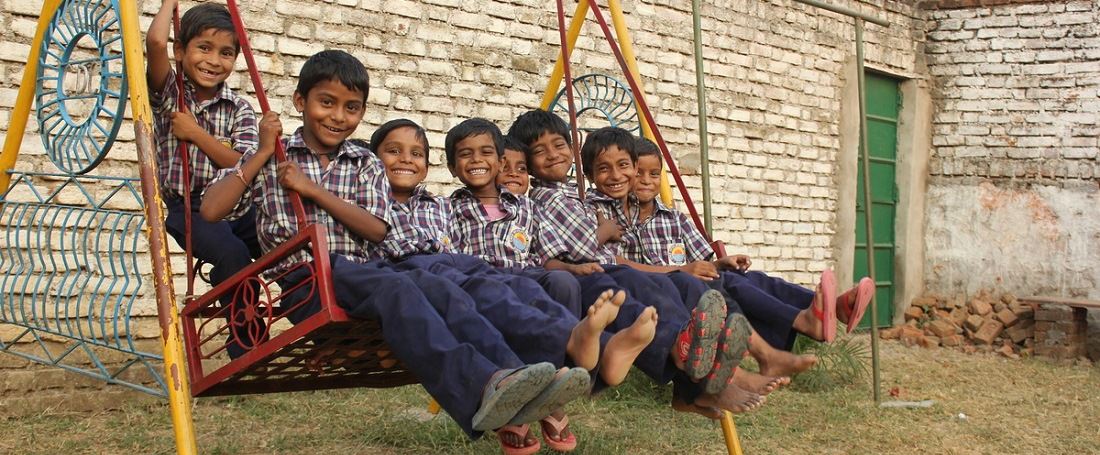 Indian children on swing