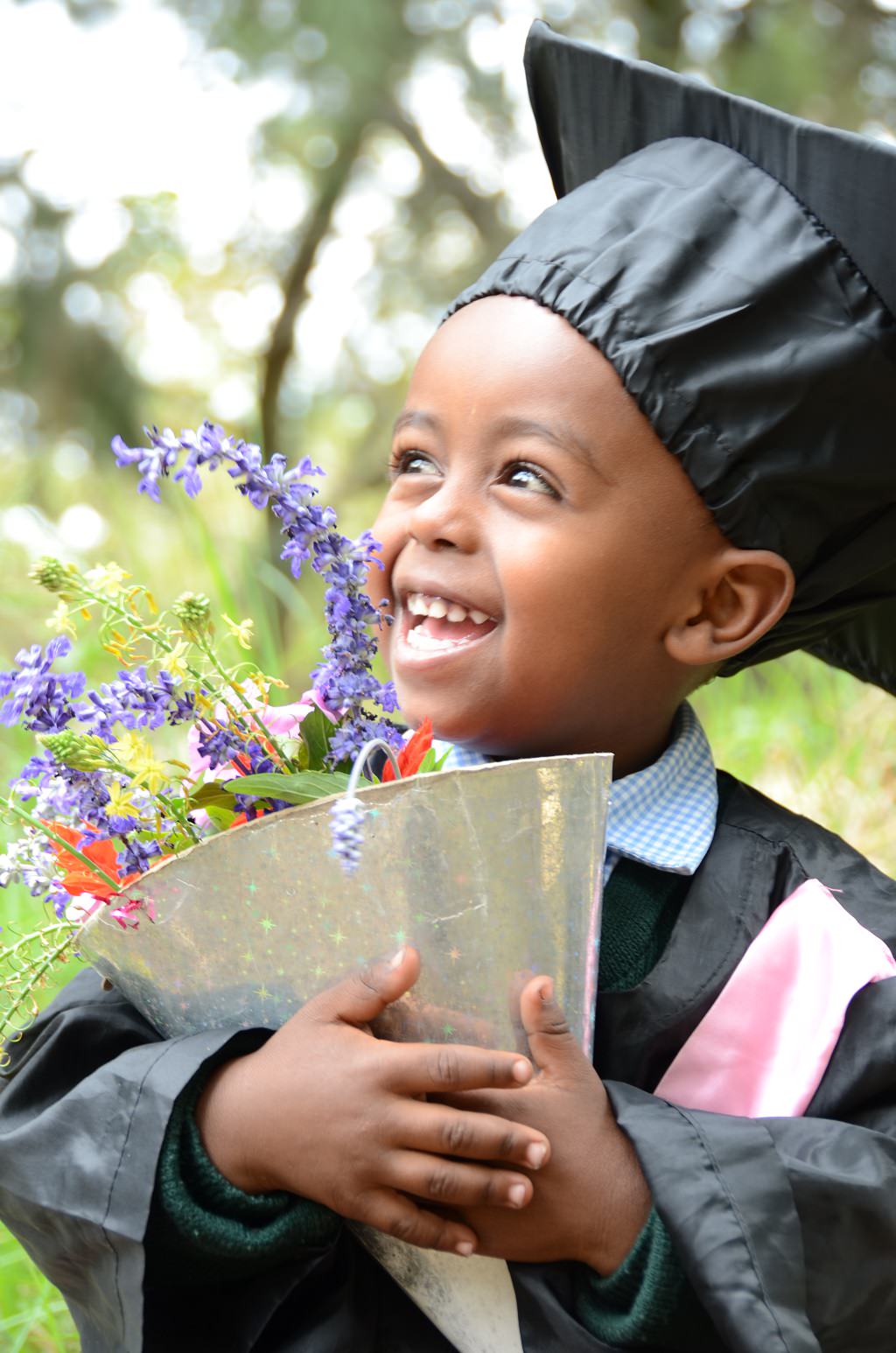 Hermonium with his graduation bouquet. 