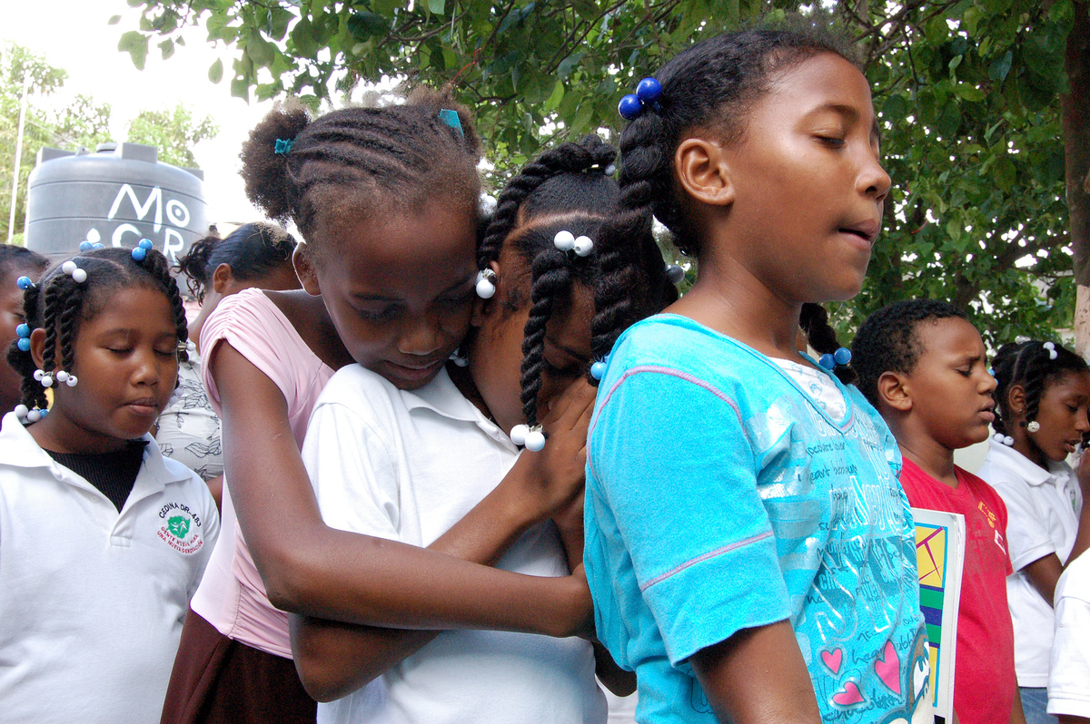 Children hugging in Haiti