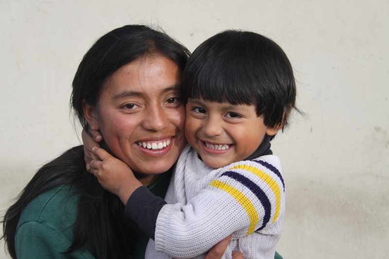 Mother and child hugging