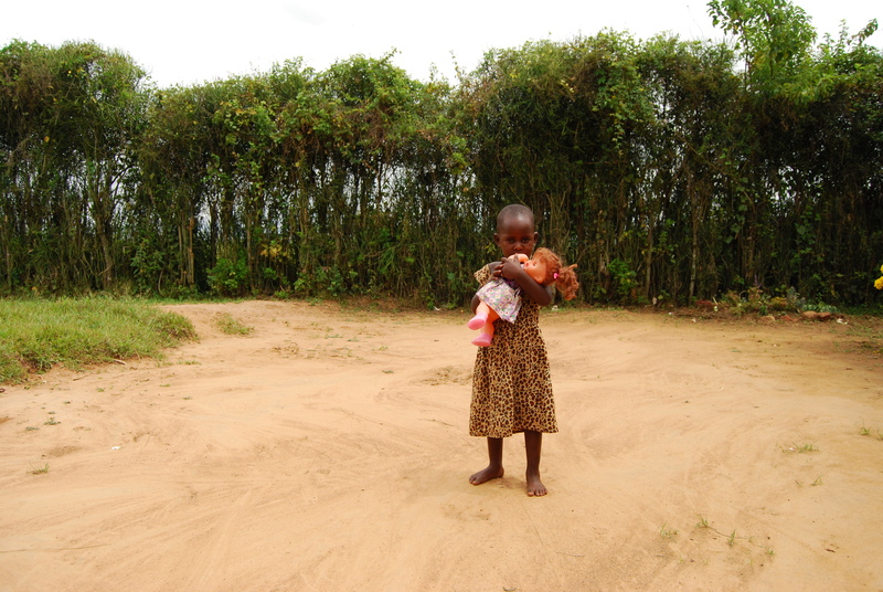 Ghanaian sponsored child hugs her doll