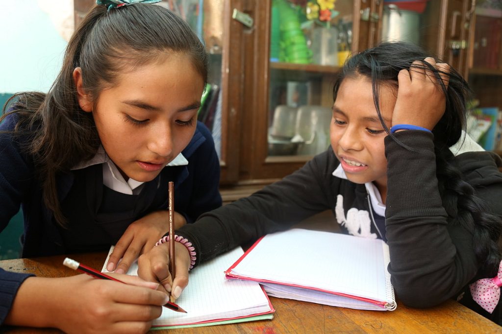 Bolivian girls doing homework