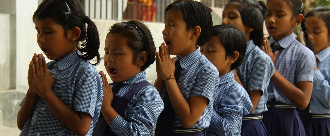 Indian children praying