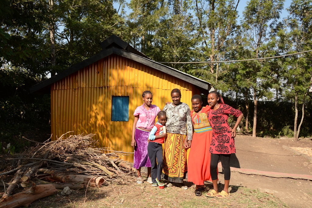 Masaai girl with her family