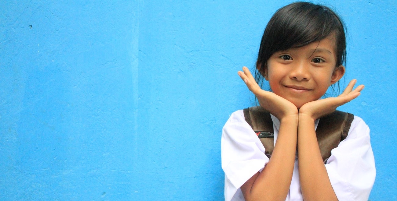 Indonesian girl smiles to the camera