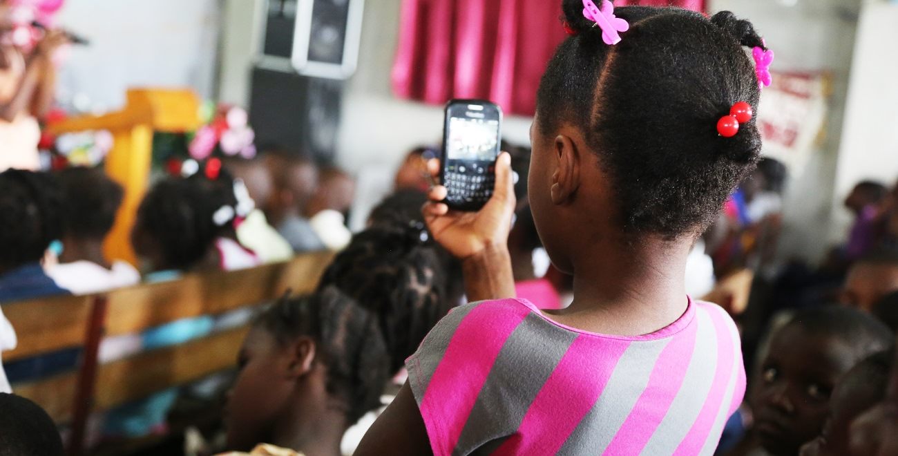 Haitian girl with mobile phone