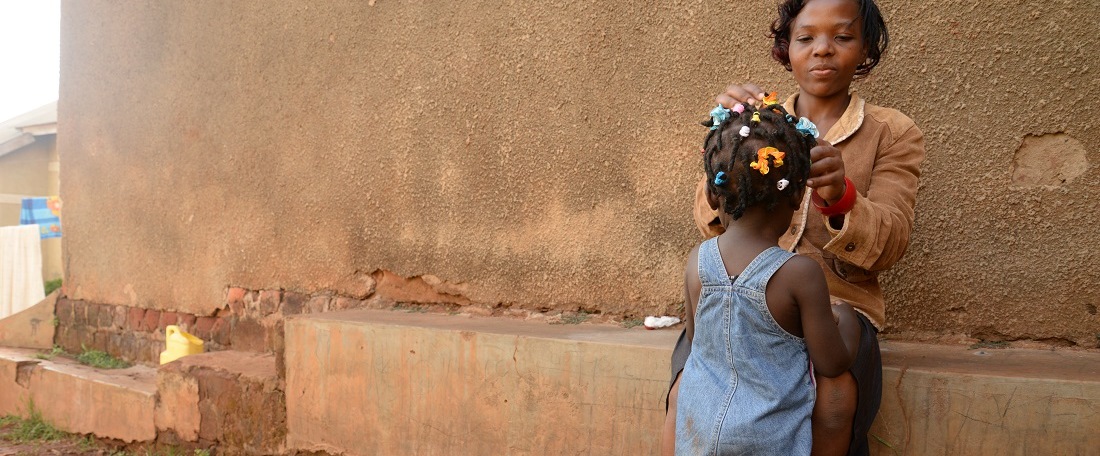 Little girl having her hair done