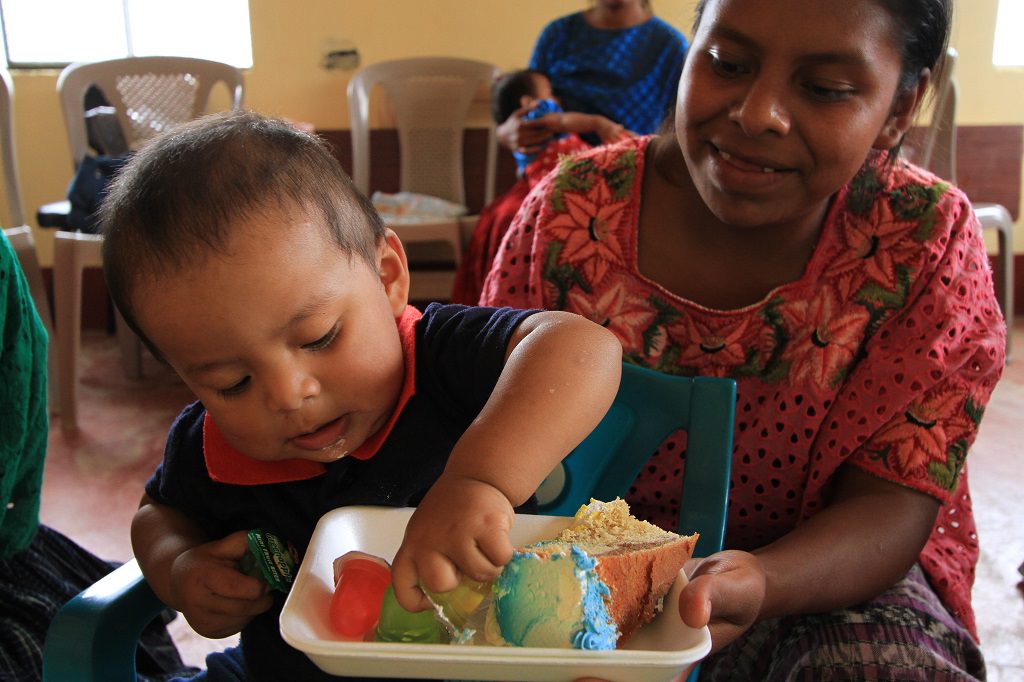 Baby Marcus eating cake