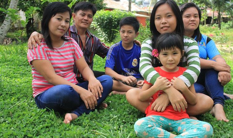 Meina and her family in Indonesia