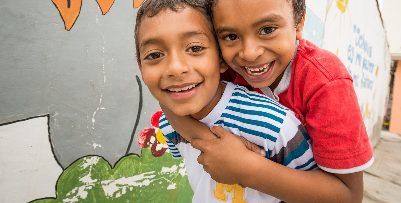 Boys piggybacking in Ecuador