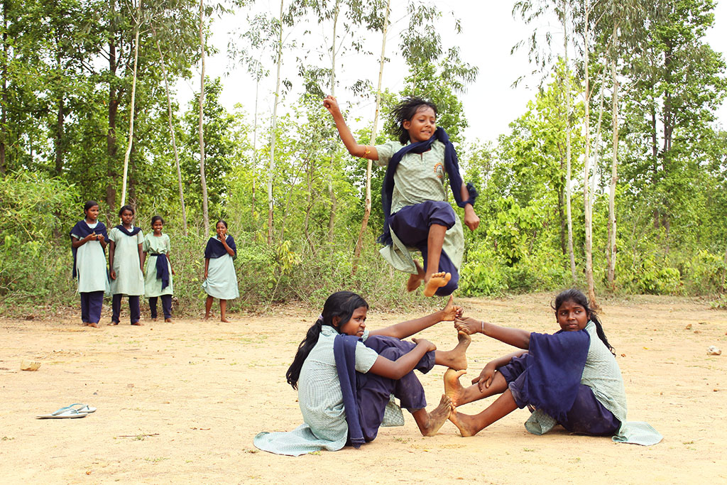 Girls play jumping game in India.