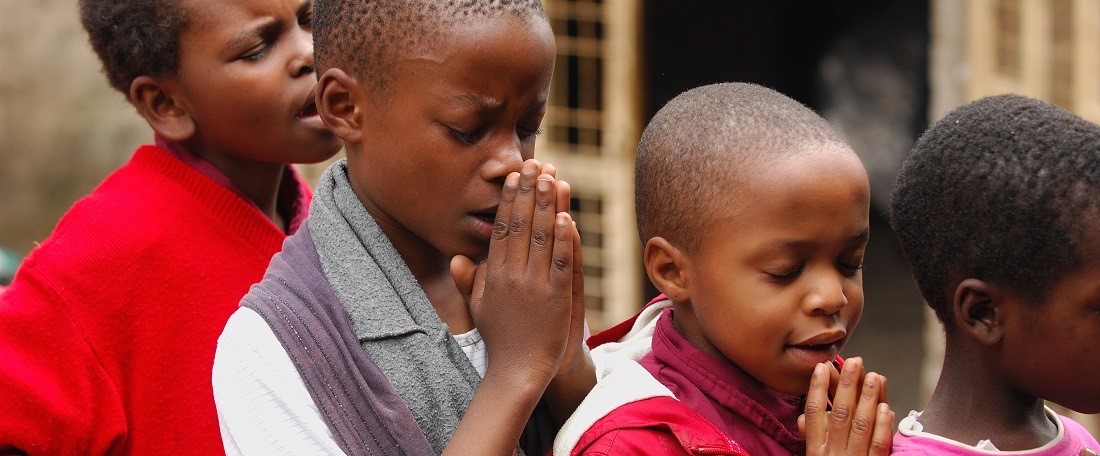 Tanzanian children praying