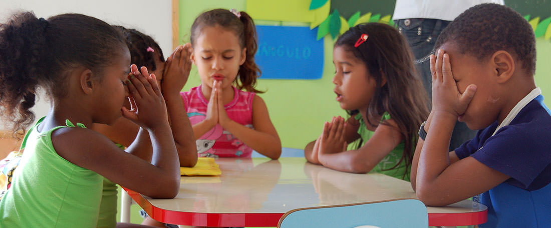 Group of Brazilian children praying