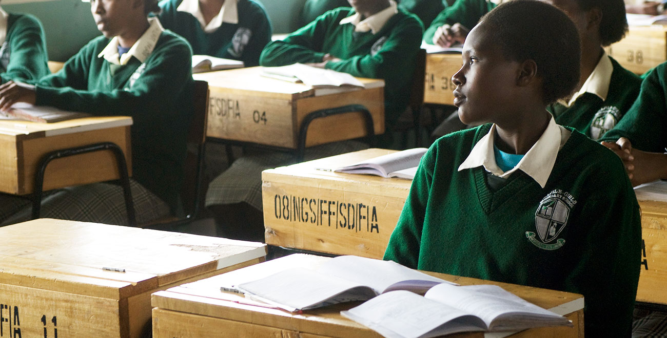 Girl sitting at desk in Kenya