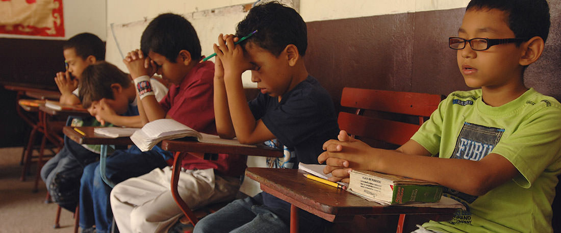 Boys praying in Nicaragua