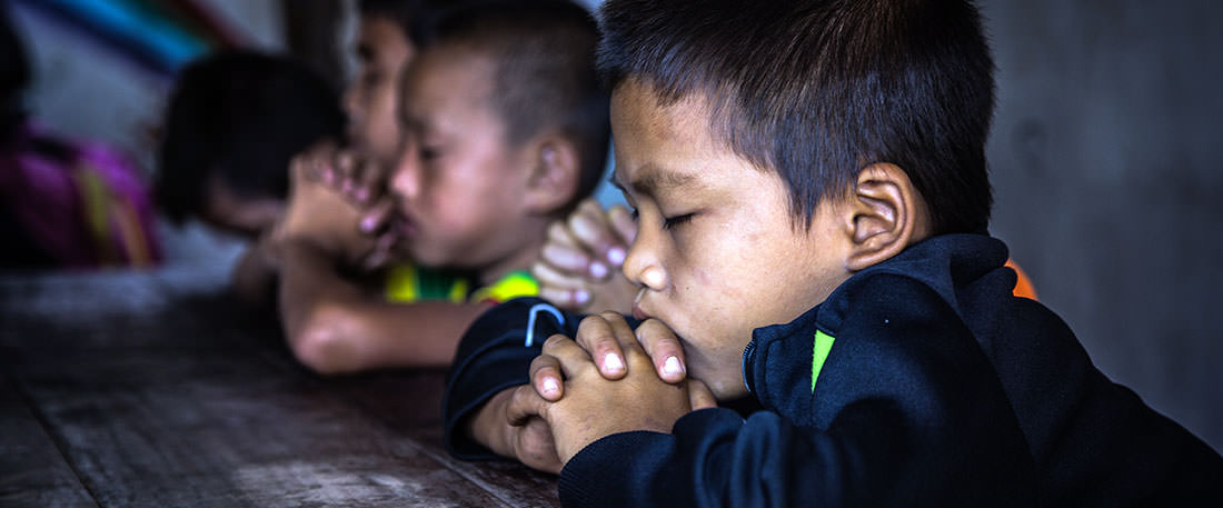 Children praying in Thailand