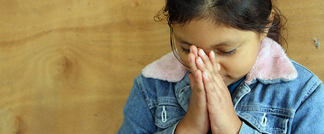 Girl from Guatemala praying