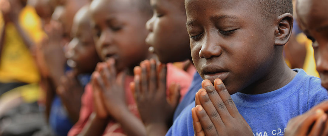 Ugandan children praying