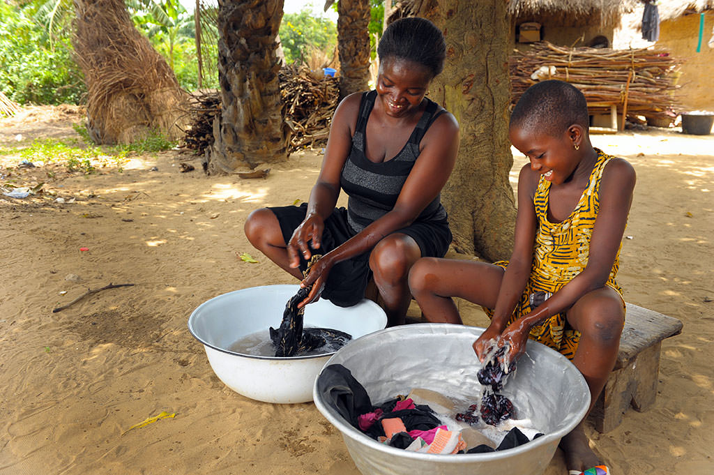 Nunana and Rose washing clothes together