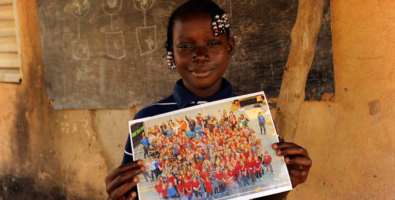 Holding a photo from her sponsor