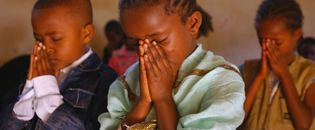 Children praying in Ethiopia