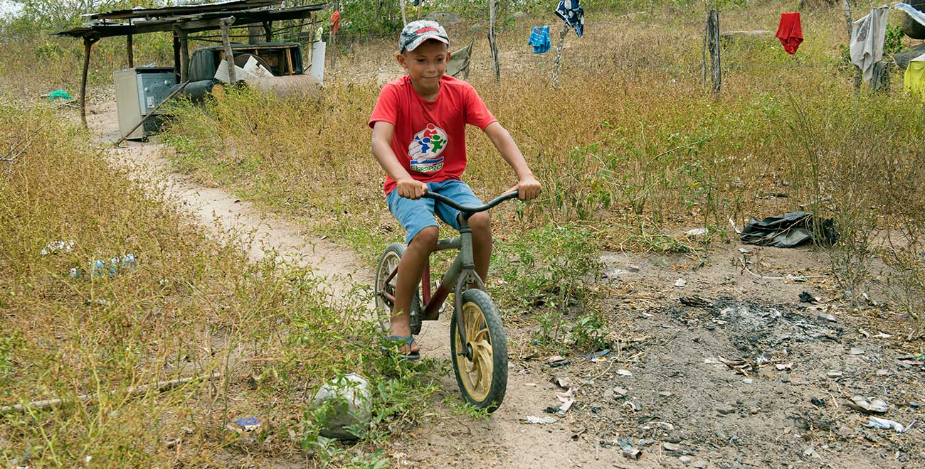 Sponsored child Samson riding his bike in Brazil