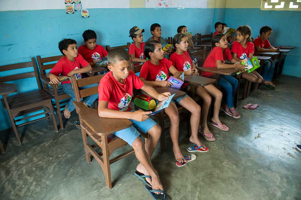 Tiago studying at his Compassion project.