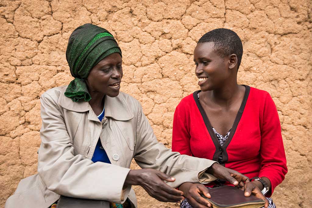 Mother and daughter reading Bible Rwanda
