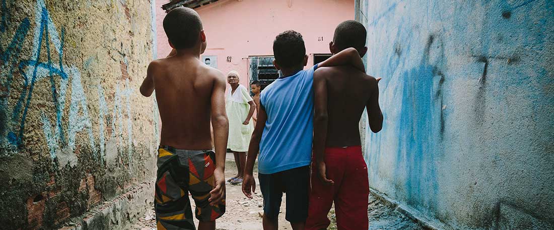 Boys walking down street in Brazil