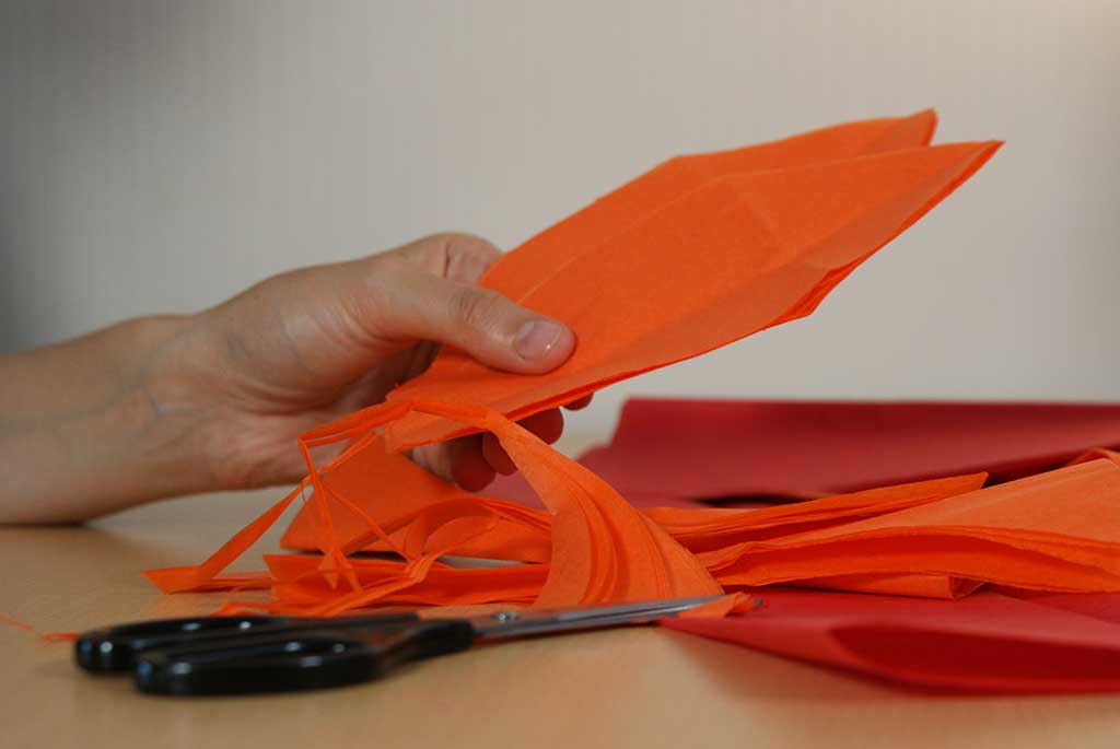 Cutting flames from tissue paper