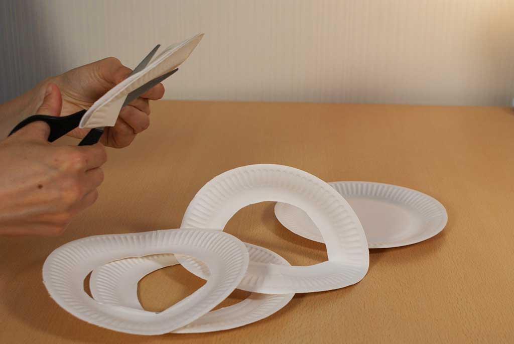 Cutting holes in paper plates