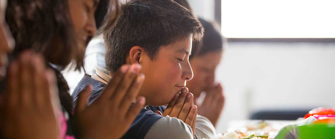 Group praying in Latin America