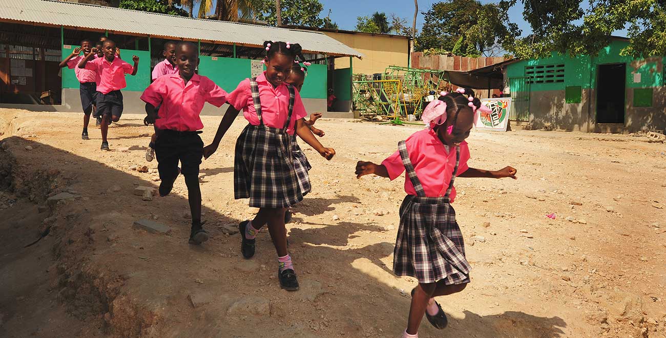 Children running in Haiti