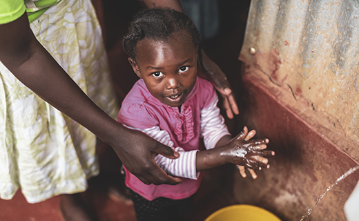 girl washing hands in Kenya