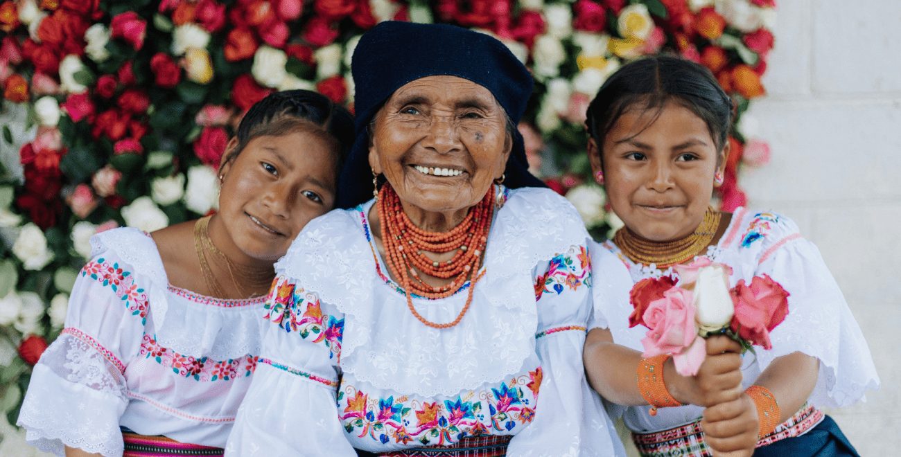 Angelita sits with her granddaughters