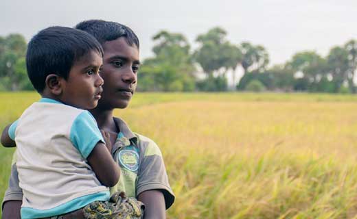 Two boys in a field in Sri Lanka